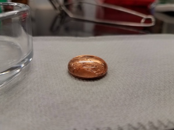 60 drops of water on a coin. - Coin, Water, Surface tension