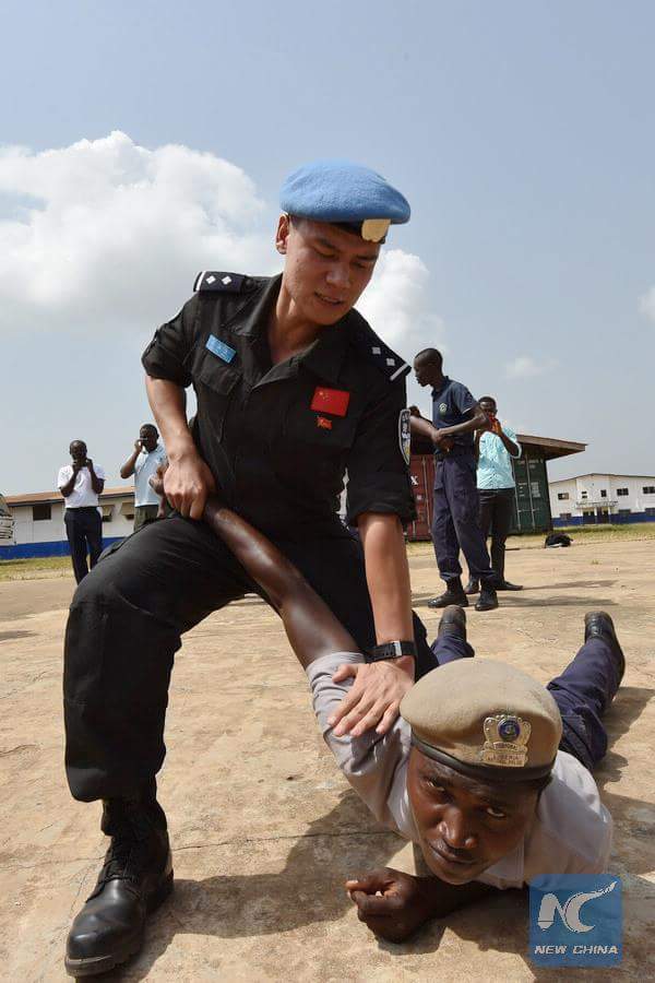 Chinese peacekeepers in Liberia train local police. - Chinese, , Peacekeepers