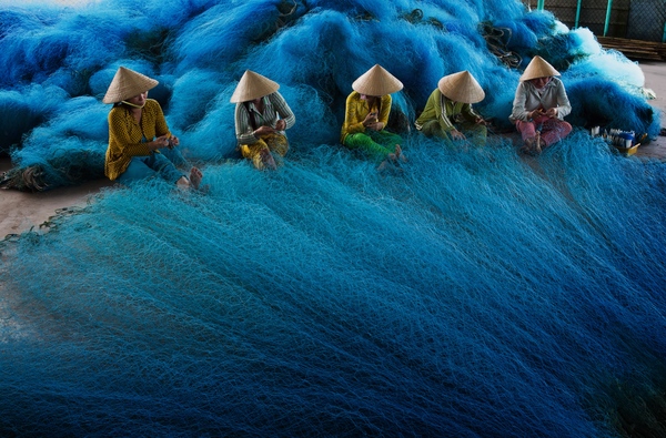 Weaving a fishing net (Mekong Delta, South Vietnam) - Fishing, A fish