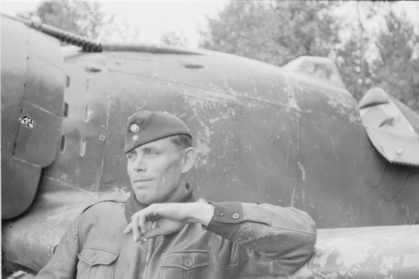 Finnish pilot O. Tuominen smokes, leaning on the wing of his Fiat G.50 fighter. - Aviation, Technics, The Second World War, Airplane, Pilots, Ace, The photo, Finland
