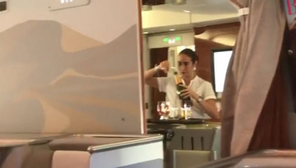 Stewardess pouring unfinished champagne into a bottle caught on video - Dubai, Airline, Fly Emirates