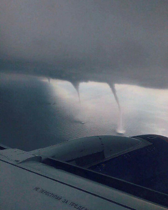 Today, 9 tornadoes formed over the sea in the Sochi region. Keep a photo from a passenger plane that flew right above them) - Tornado, Airplane, Sochi