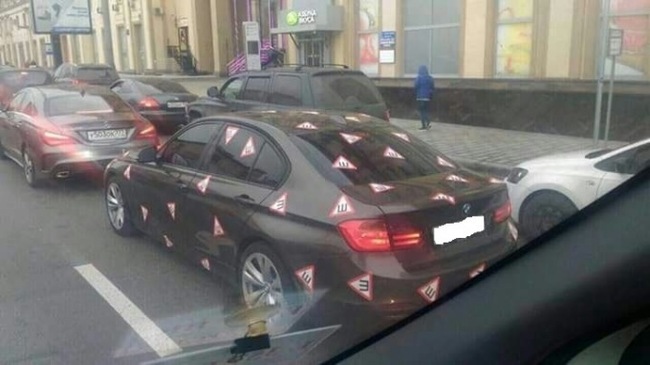 Muscovite pasted over the car with the sign Spikes - Thorns, Moscow, Black Market, Sign of the SPIKE