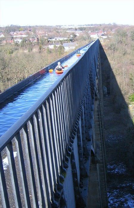 Aqueduct crossing. - Reddit, The photo, A boat, Kayak, Water, Bridge, Crossing