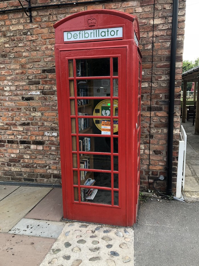 The pub converted a phone booth into a defibrillator and added a small library - Reddit, Rework