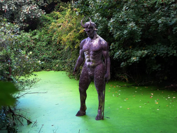 A 2.5 meter tall statue of Lucifer, installed by someone in a pond. Surely looks cool at night - Sculpture, Pond, Art, Bricks