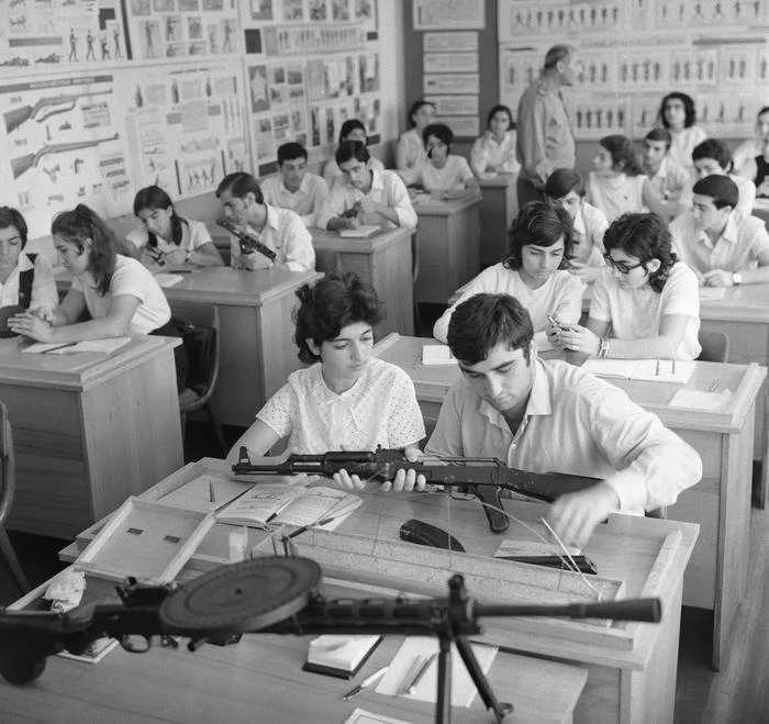At the NVP lesson - NWP, Firearms, Pupils, Schoolgirls, School years, Black and white photo, the USSR, School