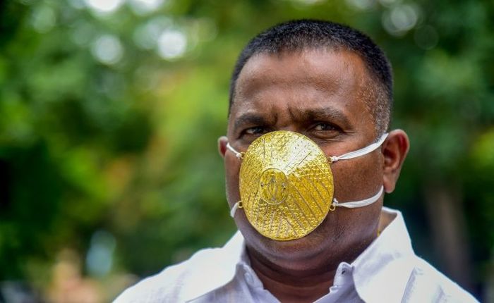 Indian man wears a gold mask to protect himself from coronavirus - India, Coronavirus, Golden mask