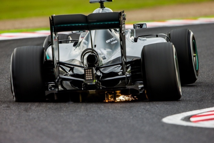 Formula 1 car under load in a corner - Formula 1, Photo