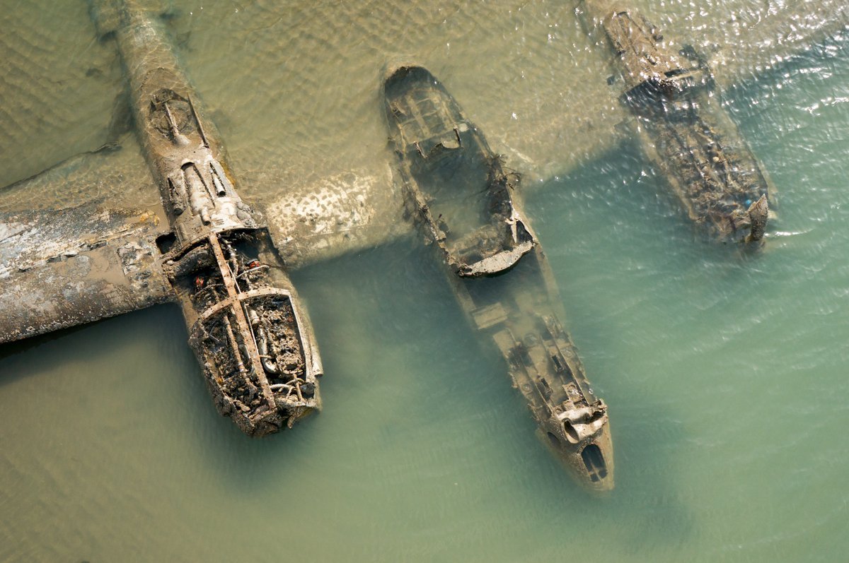 The remains of an American P-38 Lightning fighter that crashed off the coast of Wales during World War II - The Second World War, Airplane, Photo