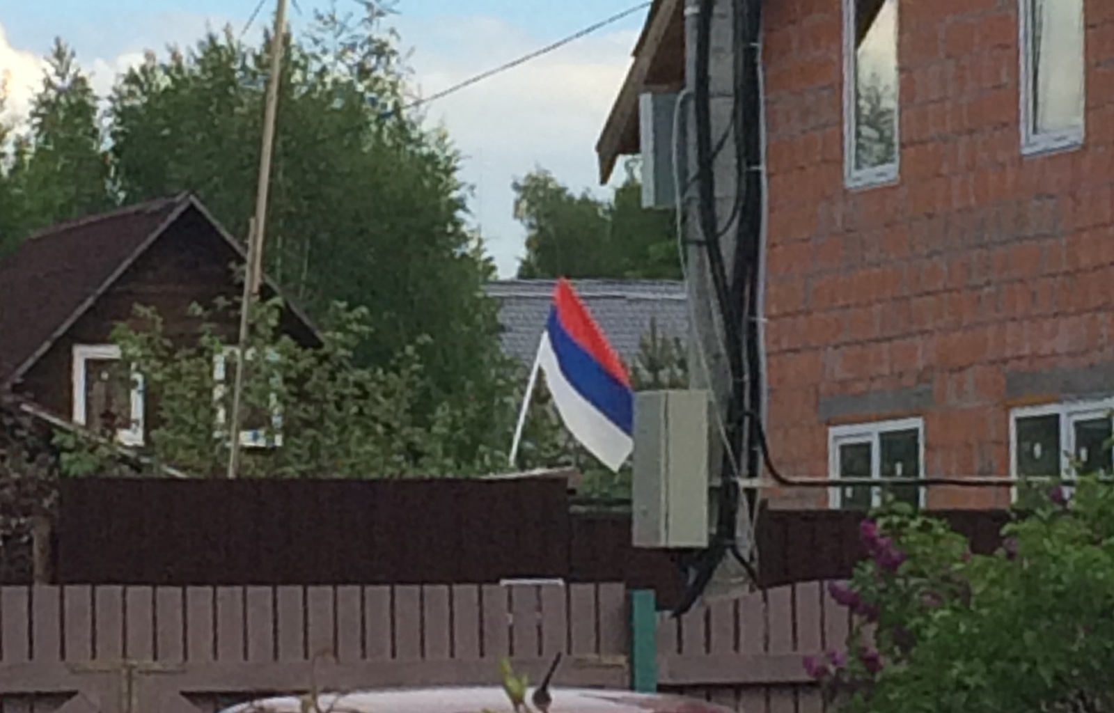 Guess the flag of whose country our neighbor hung on Russia Day - Yeah, Russia