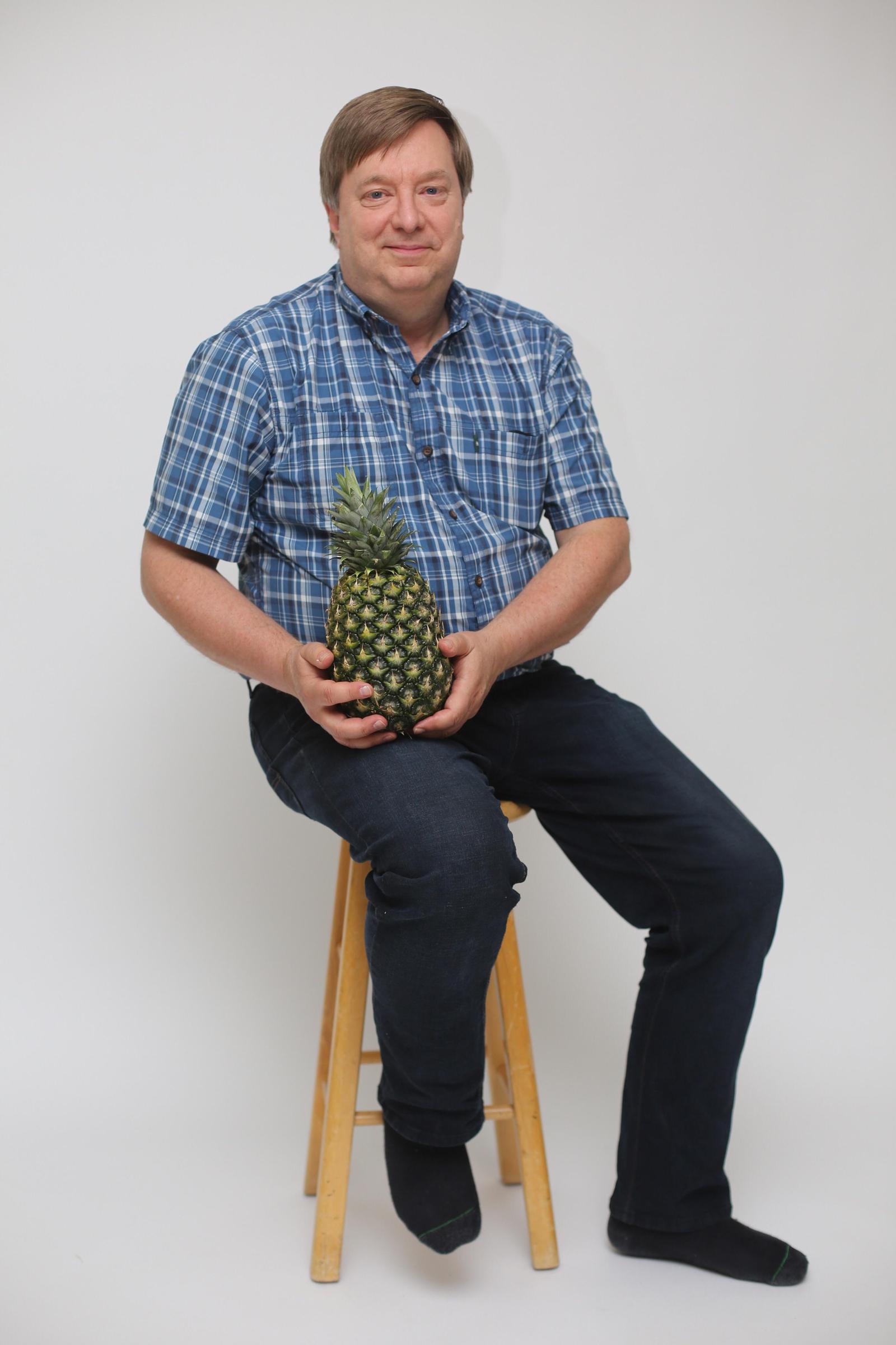 A man who managed to grow a pineapple at home. - Father, Pride