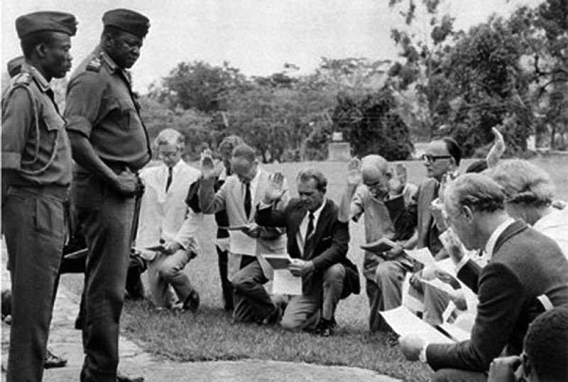 White businessmen swear allegiance to Ugandan dictator Idi Amin, 1975. - go amin, Dictator